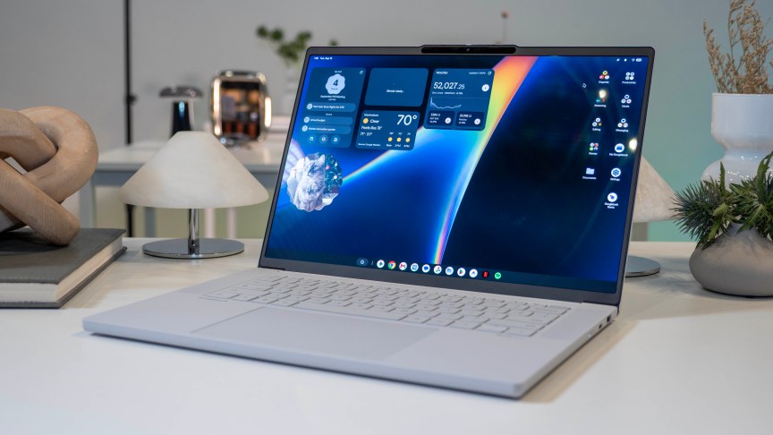 Lenovo Googlebook 15 on a white desk surrounded by desk items.